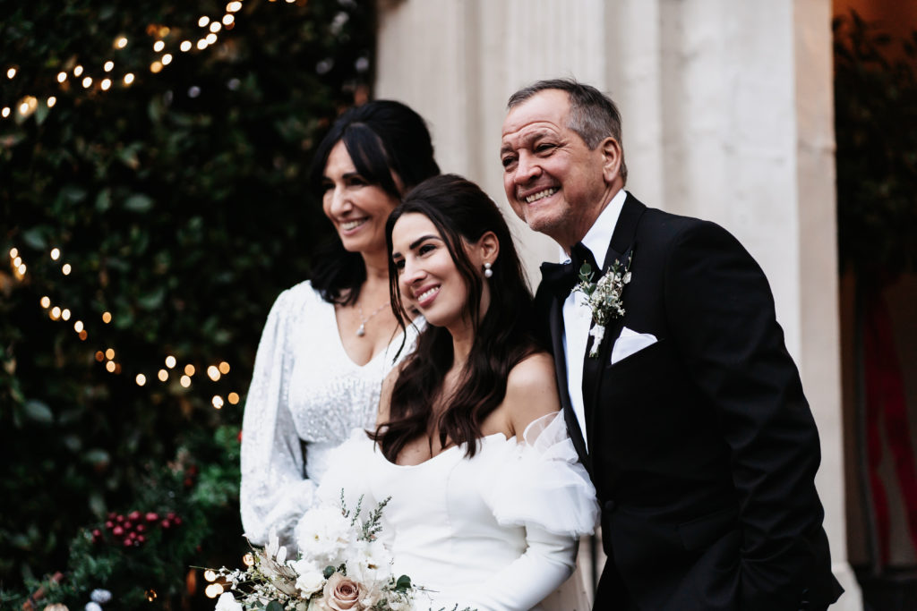 Dark haired bride with parents 
