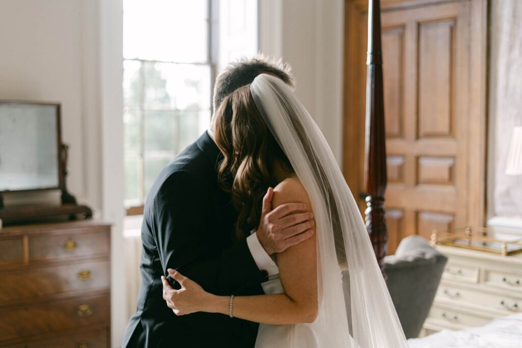 The bride embraces her dad