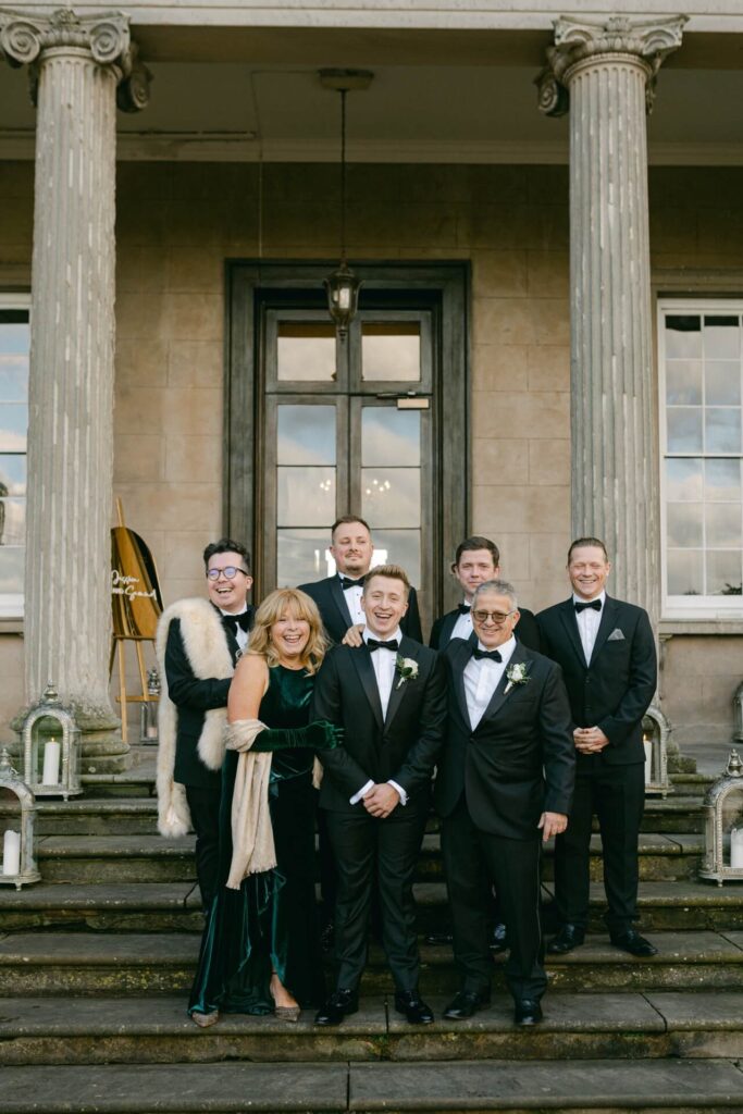 A family photo on a black tie wedding